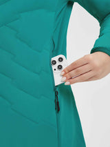 Teal women's mid-length jacket with zippered pocket holding a smartphone. #Color_Green