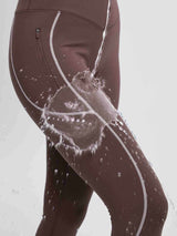 Waterproof fleece cycling leggings, dark brown, with zipper pocket & white stitching. Water beading off.