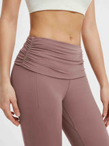 Dusty rose yoga pants with a ruched fold-over waistband and seamless front. #Color_Brown
