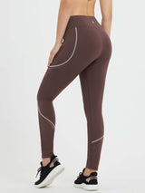 Brown fleece-lined leggings with reflective piping and side zipper pockets for women's cycling. #color_Dark Brown