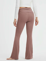 Muted rose yoga flared pants with fold-over high waist, 30-inch bootcut leg, and side pockets. #Color_Brown