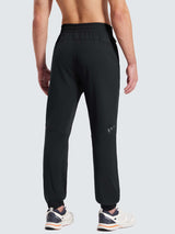 Men's black fleece joggers with reflective detailing on the lower leg and cuffed ankles. #color_Black