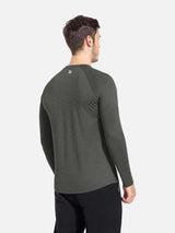 Men's slim-fit long sleeve crewneck shirt in heather charcoal. Back view with white logo. #color_Heather Gray
