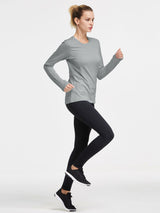 Woman running in grey long-sleeve fleece crew pullover with thumb holes. Women's athletic running top. #color_Light Gray