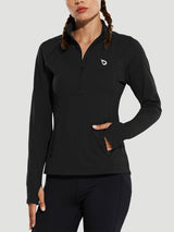 Woman wearing a black long-sleeved half-zip pullover running top with thumbholes and a zippered pocket. #color_Black