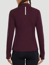 Back view of women's burgundy long sleeve running top with thumbholes and reflective stripe.