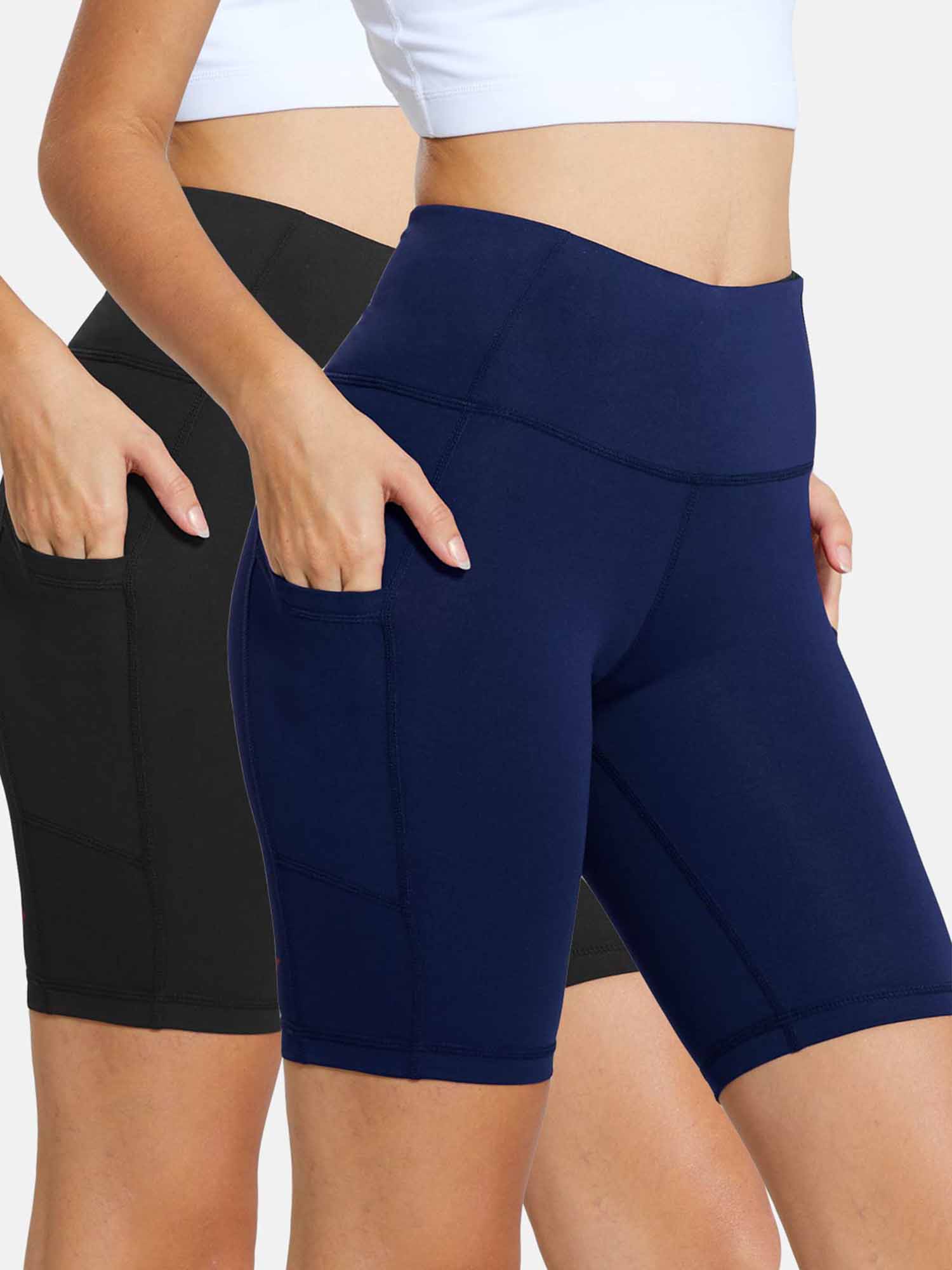 Two women wearing high-waisted yoga shorts, one in black and one in navy, with pockets. #color_Black/Blue