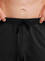 Men's black cotton straight-leg lounge pants with drawstring waist. #color_Black
