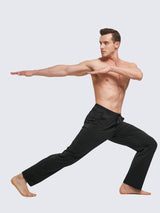 Man in black cotton straight-leg lounge pants performing a yoga pose #color_Black
