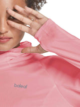 Woman wearing a pink UPF 50+ hiking shirt with face cover and thumbholes. #color_Pink