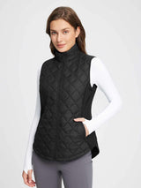Women's black quilted insulated golf vest with zipper and pockets #color_Black