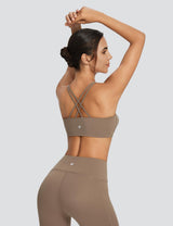 Beige yoga set: high-rise shorts and spaghetti strap low impact bra.