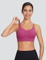 Berry Y-back low-strength sports bra on woman, part of the Move-Freely Comfort Set for yoga. #color_Hot Pink