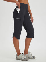 Women's black 17-inch capris for cycling and hiking, featuring secure zipper pockets. #color_Black