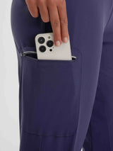 Navy blue women's 17" cycling hiking capris with zippered thigh pocket holding a smartphone. #color_Navy Blue