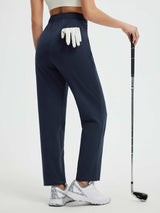 Navy blue fleece-lined golf pants with a tucked-in glove and golf club. #color_Navy Blue