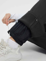 Black heavyweight fleece ski pants with adjustable drawstring ankle & fleece cuff. #color_Black