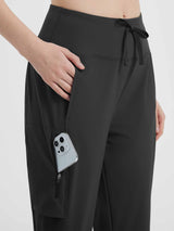 Black women's 15" hiking shorts with cargo and zip pockets, phone fits in side pocket. #color_Black