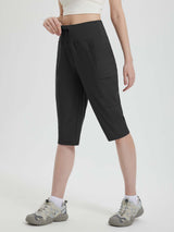 Black women's 15-inch hiking shorts with cargo pockets and adjustable drawstring waist #color_Black