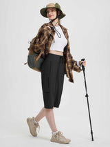 Black women's 15" hiking shorts with cargo pockets, elastic waistband, and trekking pole. #color_Black