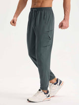Men's dark gray woven hiking joggers with cargo pockets and elastic cuffs. #color_Dark Gray