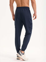 Navy blue woven men's hiking joggers with cargo pockets and tapered cuffs. Lightweight & water-resistant. #color_Navy Blue