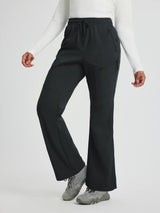 Black women's softshell straight-leg pants with zipper pockets, elastic waistband, and drawstring. #color_Black