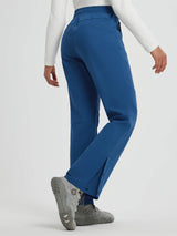 Woman wearing blue softshell straight-leg outdoor pants with zipper pockets and snap closures on the leg. #color_Cobalt Blue