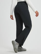 Women's black softshell straight-leg outdoor pants with zipper pockets and adjustable snap closures. #color_Black