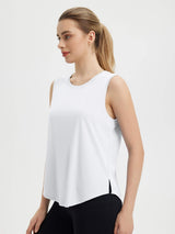 White women's sleeveless racerback running tank with curved hem and reflective details. #color_White