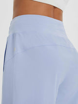 Light blue women's UPF 50+ quick-dry wide-leg capris with a high waistband and subtle logo detail. #color_Light Blue