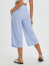 Light blue women's UPF 50+ wide-leg quick-dry running capris with pockets. #color_Light Blue