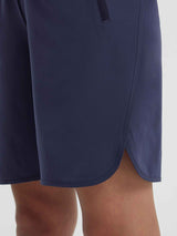 Women's navy blue high-waisted running shorts with curved hem and side slit detail. #color_Navy Blue