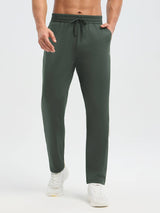 Men's dark green fleece running pants with tapered legs and dual zipper pockets. #color_Army Green