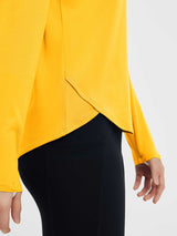 Yellow cross-hem running long-sleeve top with black high-rise shorts. #color_Yellow