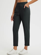 Dynamic Form high-rise tapered trousers, dark color, cuffed hem, outdoor travel wear. #color_Anthracite