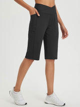 Secret Breeze 14" high-rise Bermuda shorts in black with crossover waist and pockets. #color_Anthracite