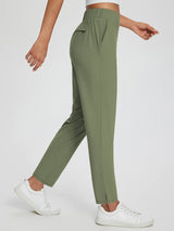 Women's olive green Sculpt High-Waist Tapered Yoga Pants with pockets and side slit ankles. #color_Army Green