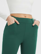 Women's green fleece-lined high-waisted leggings with deep front pockets. #color_Green
