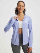 Woman in light purple UPF 50+ hooded sun jacket and grey leggings for trail wear. #color_Blue