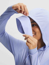 Woman adjusting hood on lightweight lavender Baleaf UPF 50+ sun jacket. #color_Blue