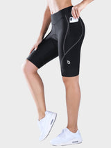 Black women's UPF 50+ padded cycling shorts with 9" inseam, side pockets, and grey stitching. #color_Dark Gray