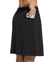 Black golf skort with secure zippered pocket holding smartphone. #color_Black
