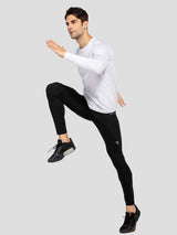 Men's black fleece-lined cycling tights with white long-sleeve shirt and running shoes #color_Black