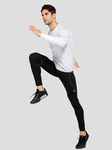 Men's black fleece cycling tights, reflective details, ankle zippers, athlete in motion. #color_Dark Gray