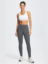 Woman wearing dark gray fleece-lined running leggings and a white sports bra. #color_Light Gray