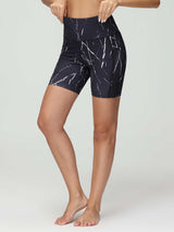 Women's 6" black high-waisted yoga shorts with a white marble print and side pockets.