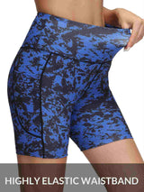 Women's blue and black printed high-waisted yoga shorts with side pockets and elastic waistband.