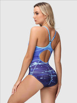 Blue ombre swimsuit with abstract paint splatter print. Spaghetti straps, cutout back.