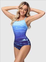 Blue ombre gradient one-piece swimsuit with white paint splatter print. Spaghetti straps.